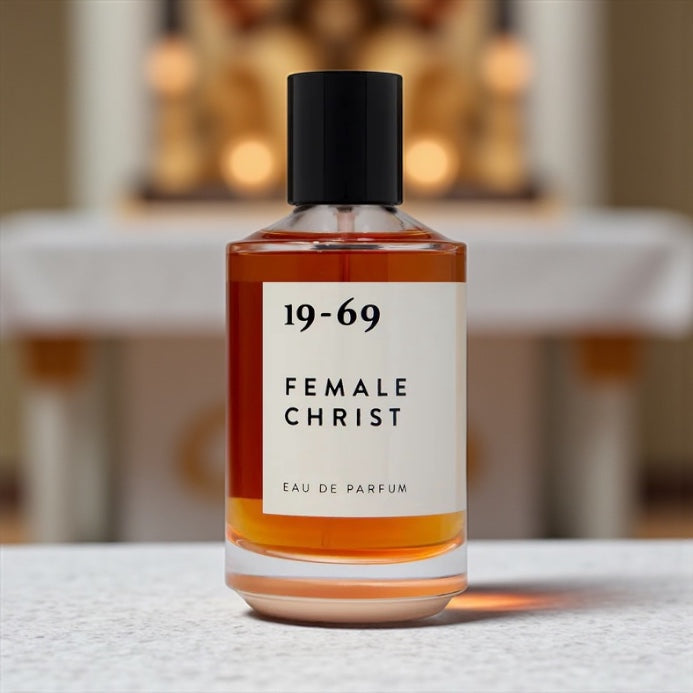 19-69 Female Christ perfume sample – earthy patchouli, eucalyptus, and amber notes styled with warm wood and minimalist tones.