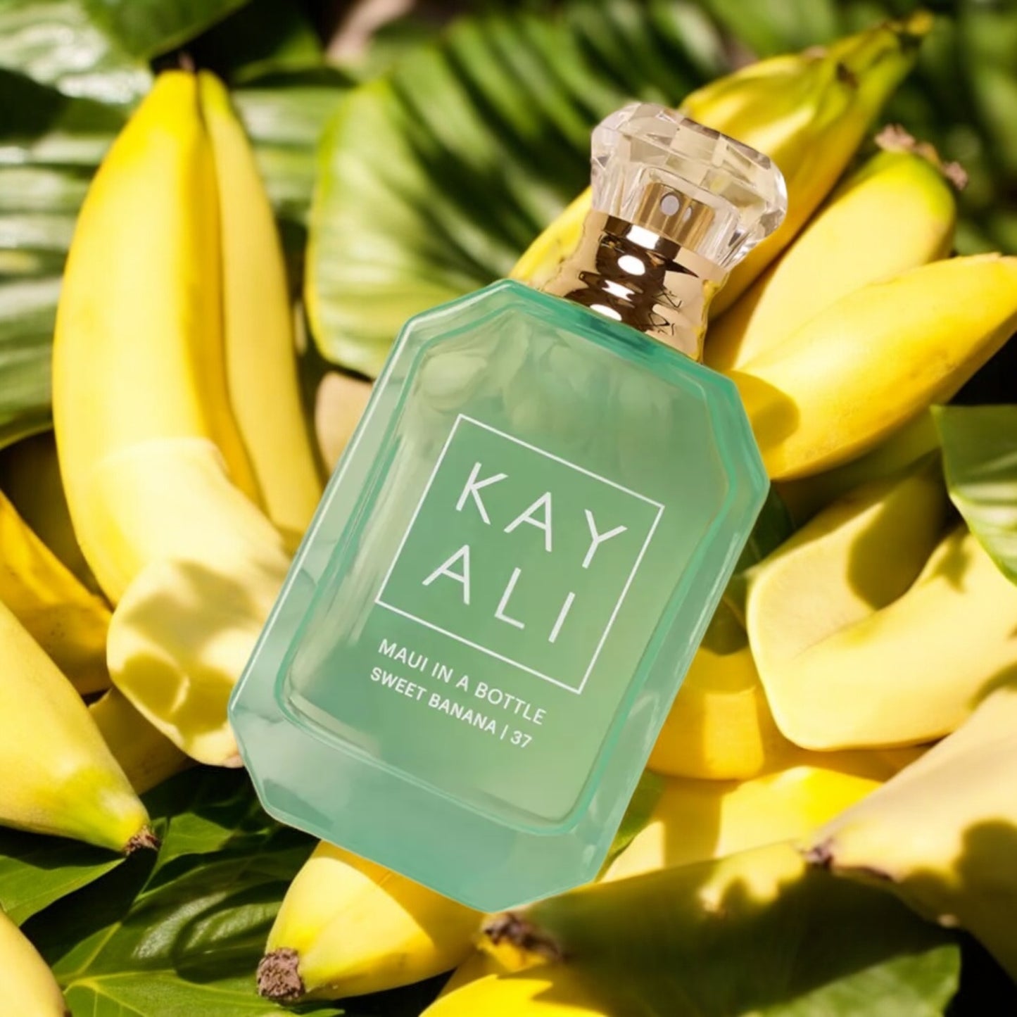 Fragrance decant styled with palm leaves, golden light, and ocean-inspired accents evoking a Hawaiian escape.