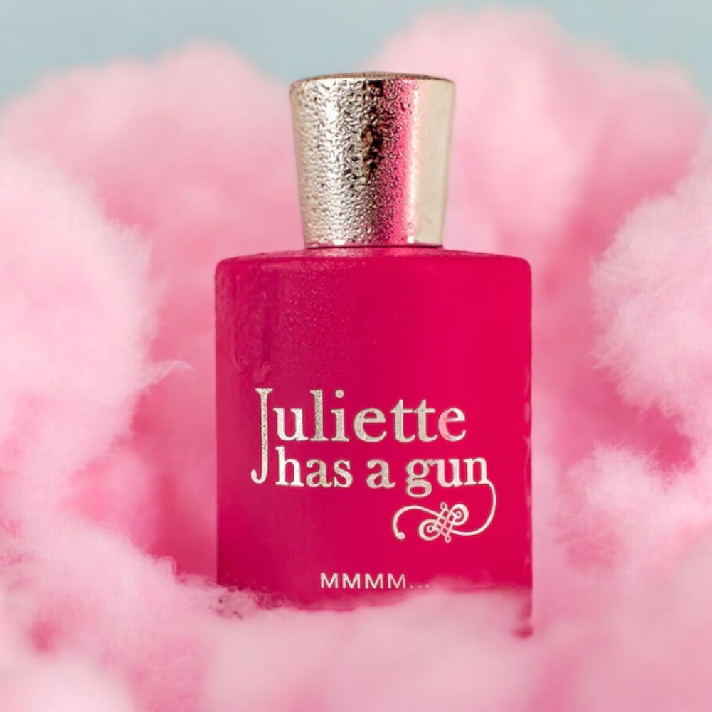 Close-up of a fragrance sample of MMMM..., highlighting its sweet floral notes and creamy, woody base for a flirtatious scent experience.