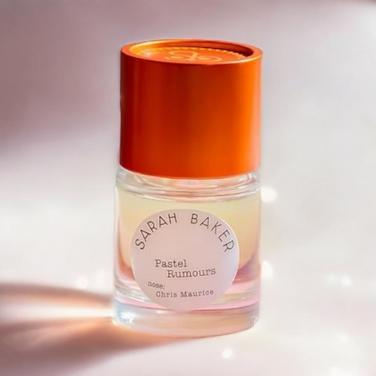 Close-up of a fragrance sample of Pastel Rumours, highlighting its playful blend of peach, fruit loops, and vanilla for a dreamy, nostalgic scent.