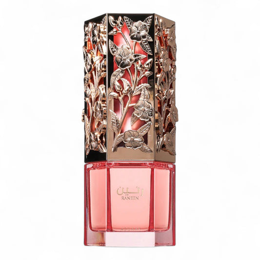 A perfume sample of Asdaaf Raneen Eau de Parfum featuring fruity notes of dragon fruit and pear blended with jasmine and warm vanilla.