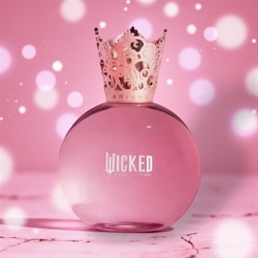 Ariana Grande Glinda Pink Bubbly perfume sample – pink apple, tulip and sugared musk notes styled in a pink pastel, bubbly setting.