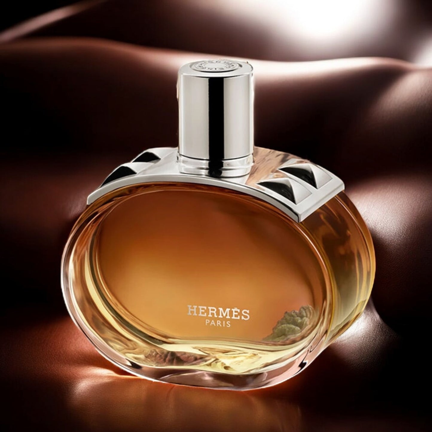 Hermès Barénia Intense perfume sample - elegant floral leather fragrance styled in a refined leather setting.