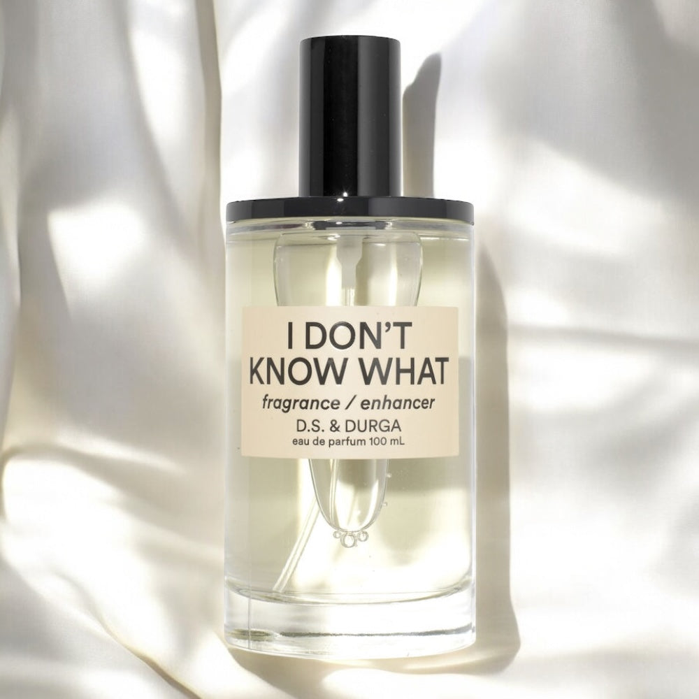 Close-up of I Don’t Know What perfume sample, designed to enhance and extend other scents with clean, radiant depth.