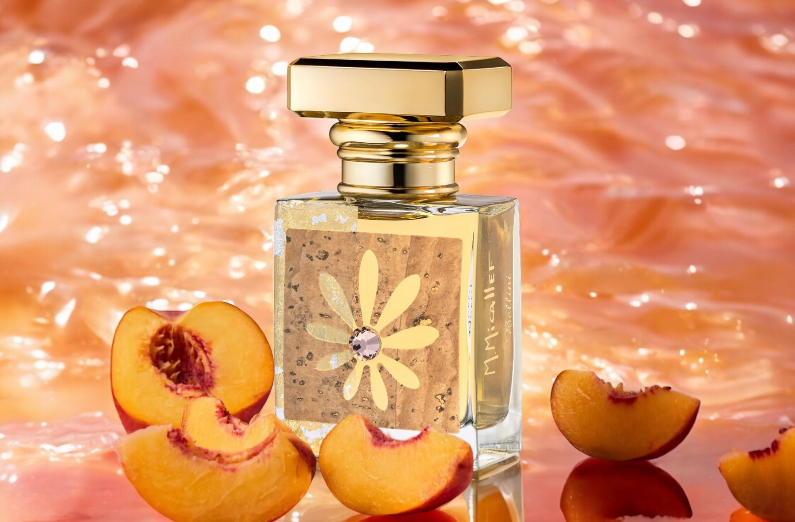 Bellini by M. Micallef surrounded by peach slices on a sparkling chanpagne background