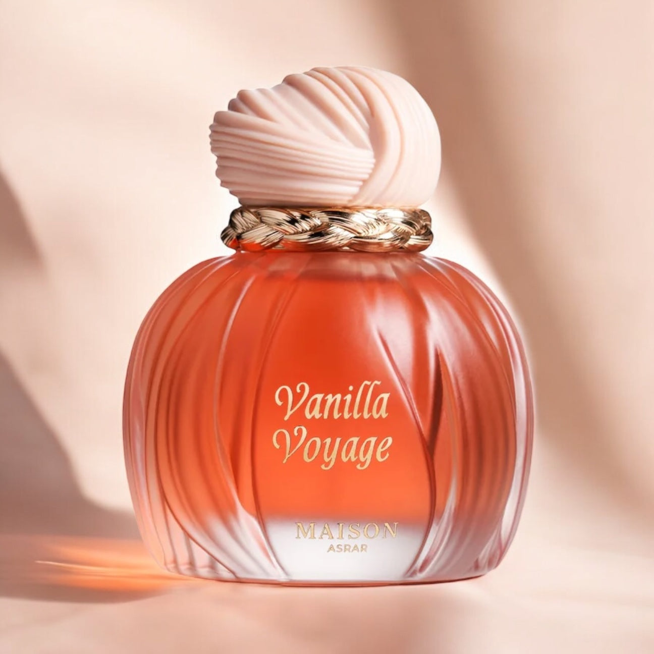 Maison Asrar Vanilla Voyage perfume sample - warm vanilla and caramel fragrance styled in a soft, golden-toned setting.