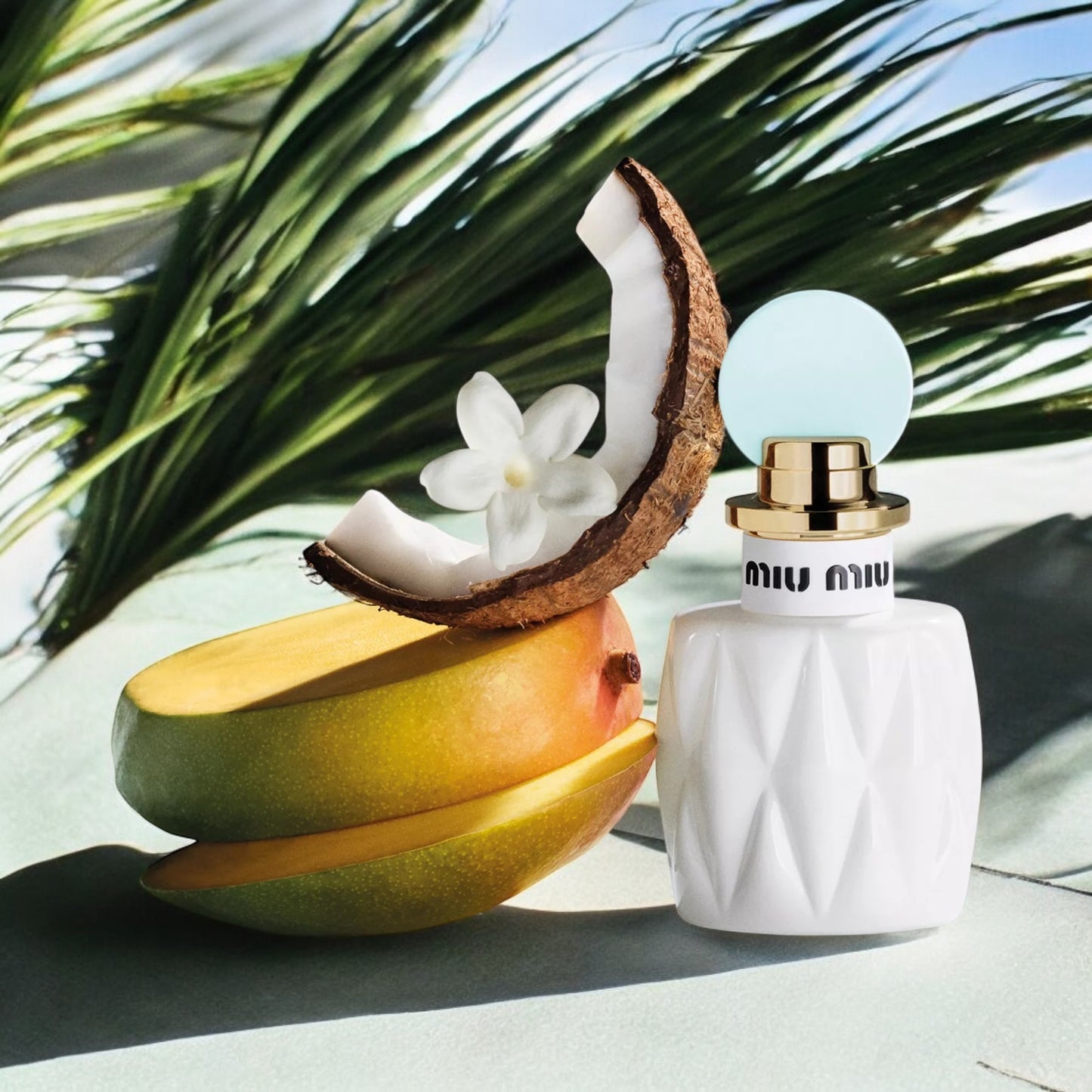 Miu Miu Fleur de Lait fragrance sample – tropical mango, osmanthus and coconut milk styled in a bright summer setting.
