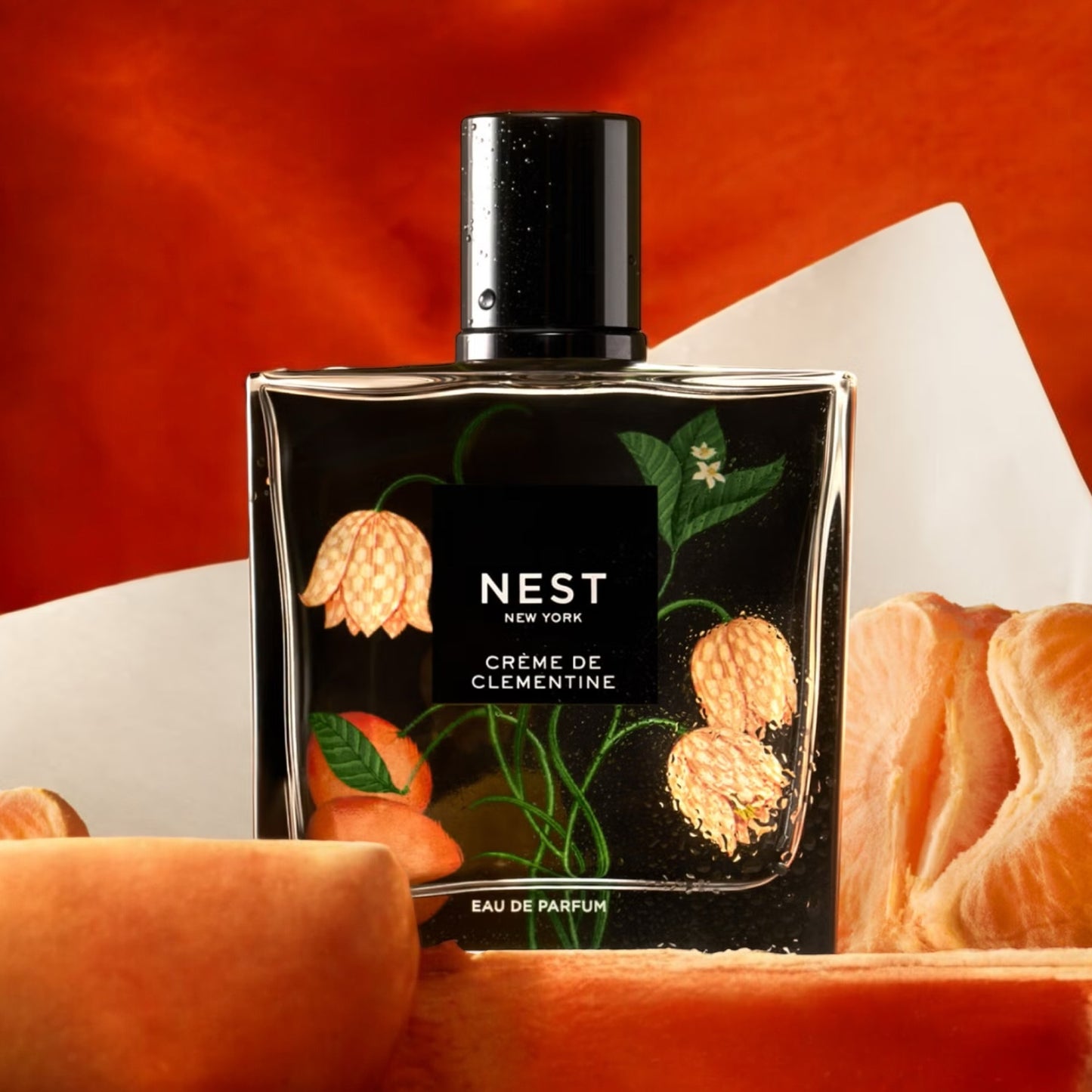 NEST Crème De Clementine fragrance sample – clementine zest and vanilla crème styled in a bright lifestyle setting.
