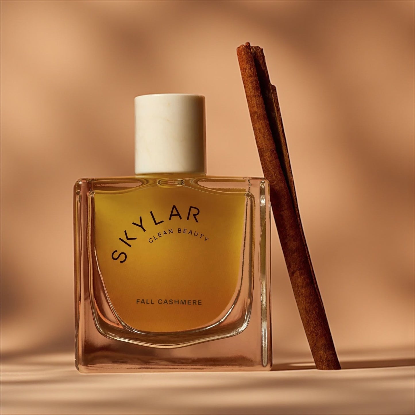 Skylar Fall Cashmere perfume sample – warm vanilla, cinnamon and sandalwood notes styled in a cozy autumn setting.