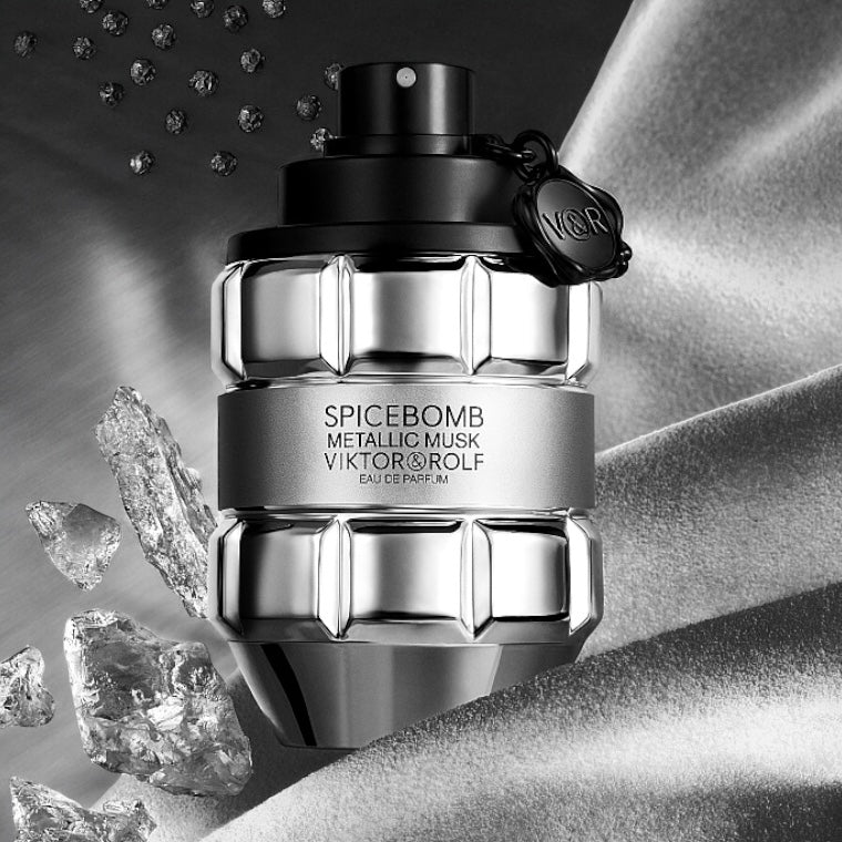 Spicebomb Metallic Musk perfume sample - bottle styled with metallic tones and leather texture, evoking sleek masculinity.