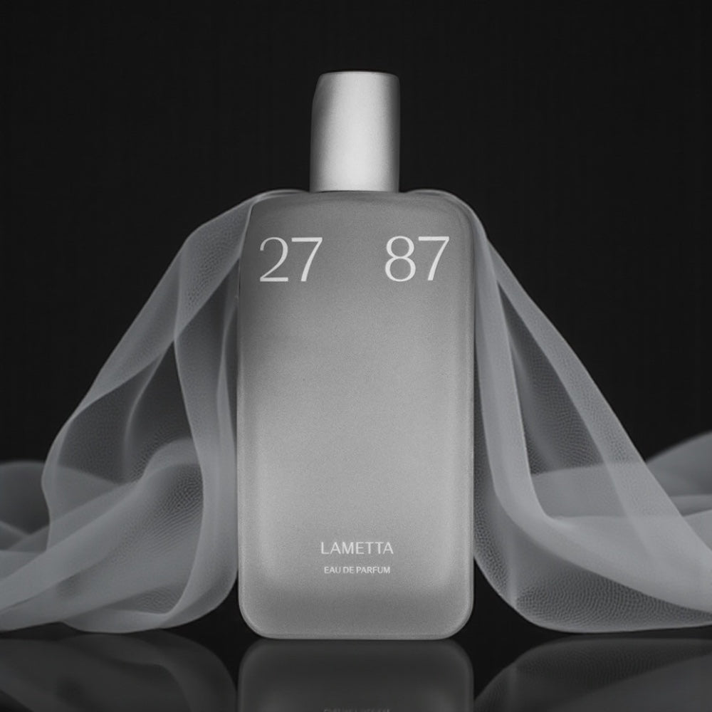 27 87 Lametta perfume sample – minimalist clean musk and soft wood fragrance in a sleek neutral setting.