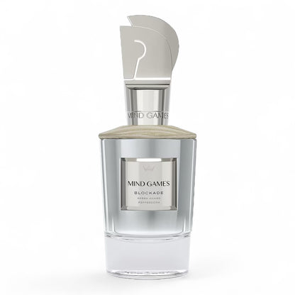 Close-up of Mind Games Blockade sample vial, highlighting the tropical mango and leathery fragrance profile.