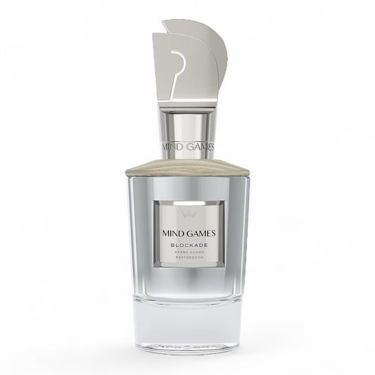 Close-up of Mind Games Blockade sample vial, highlighting the tropical mango and leathery fragrance profile.