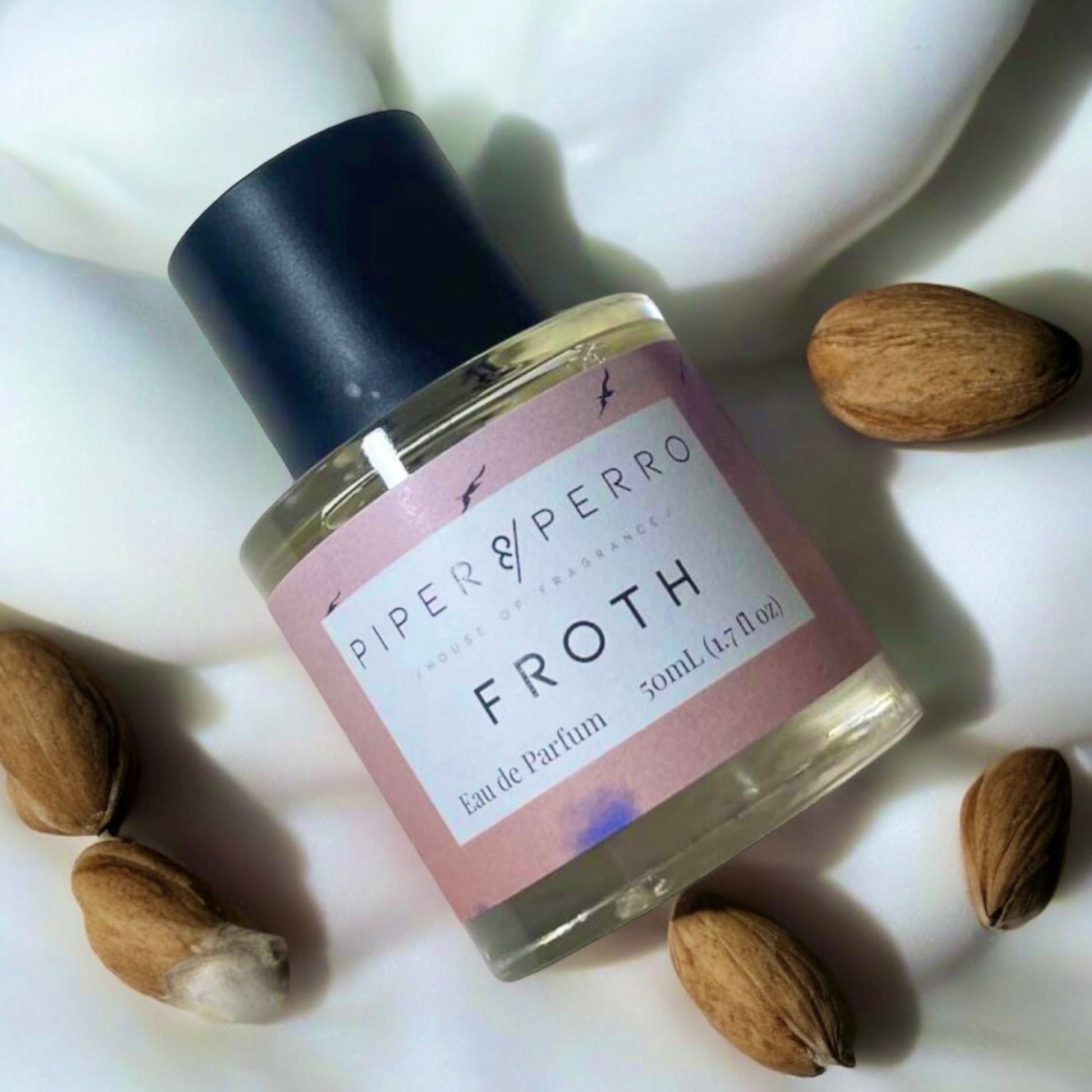 Close-up of a fragrance sample of Froth, highlighting its creamy, nutty, and floral notes for a sweet yet elegant scent experience