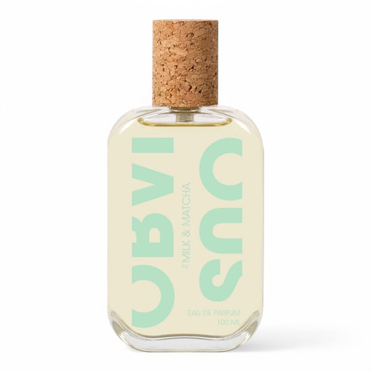 Close-up of a perfume sample vial with a fresh, green fragrance inspired by matcha latte, featuring soft, creamy notes and a velvety matcha accord. High-quality perfume decant, perfect for trying before you buy
