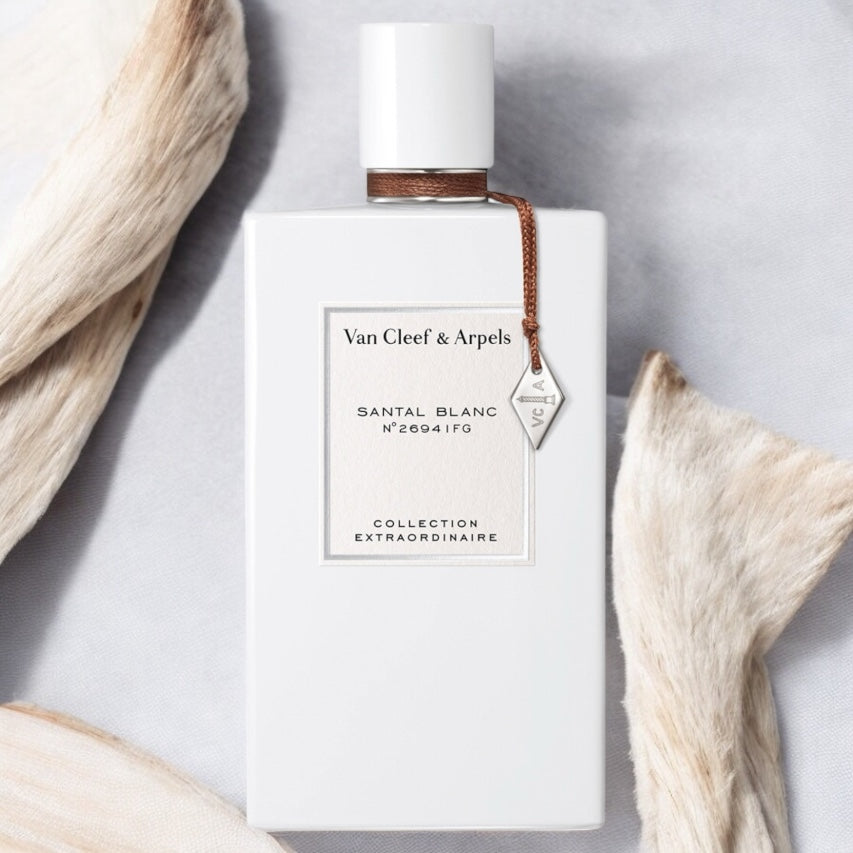 Close-up of a fragrance sample of Santal Blanc, highlighting its soft, woody, and musky notes with a smooth, milky warmth