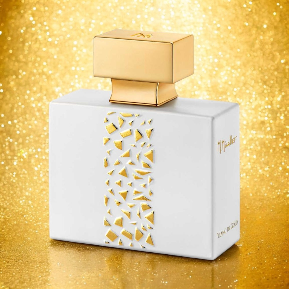 Close-up of a fragrance sample of Ylang in Gold, highlighting its tropical floral and warm vanilla notes with a golden, sunlit elegance