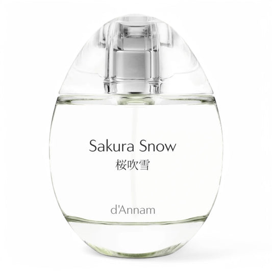 A decant of d’Annam Sakura Snow, a delicate floral fragrance with cherry blossom, snow, and white musk, available in perfume samples