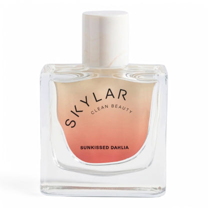 A decant of Skylar Sunkissed Dahlia, a warm floral fragrance with dahlia, vanilla custard, and amber, available in perfume samples
