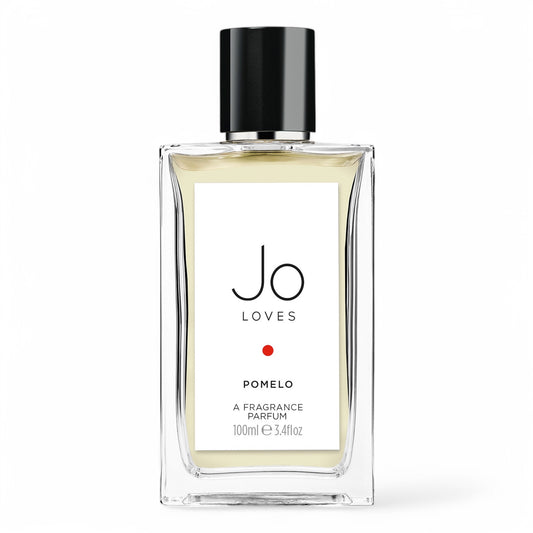 A decant of Jo Loves Pomelo, a fresh citrus-woody fragrance with pomelo, rose, and suede, available in perfume samples.