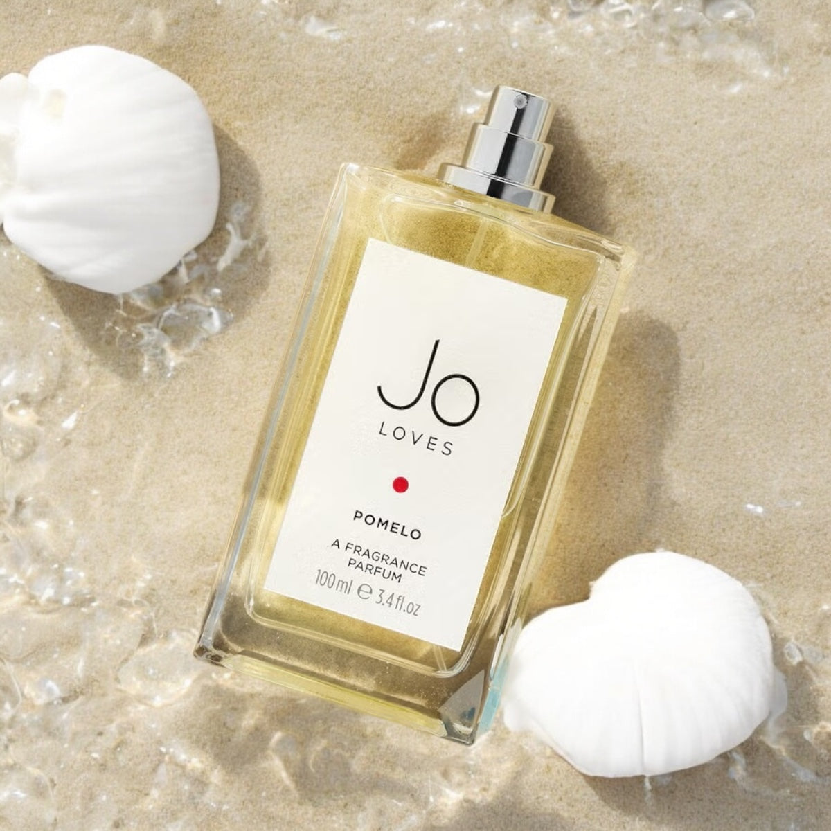 Close-up of a fragrance sample of Pomelo by Jo Loves, highlighting its bright citrus, soft florals, and smooth woody base.
