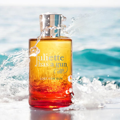 Close-up of a fragrance sample of Lust for Sun, highlighting its tropical floral notes and sun-warmed musky base.