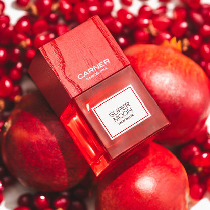 Close-up of a fragrance sample of Super Moon, highlighting its juicy fruit notes, soft florals, and musky-earthy base inspired by summer nights.