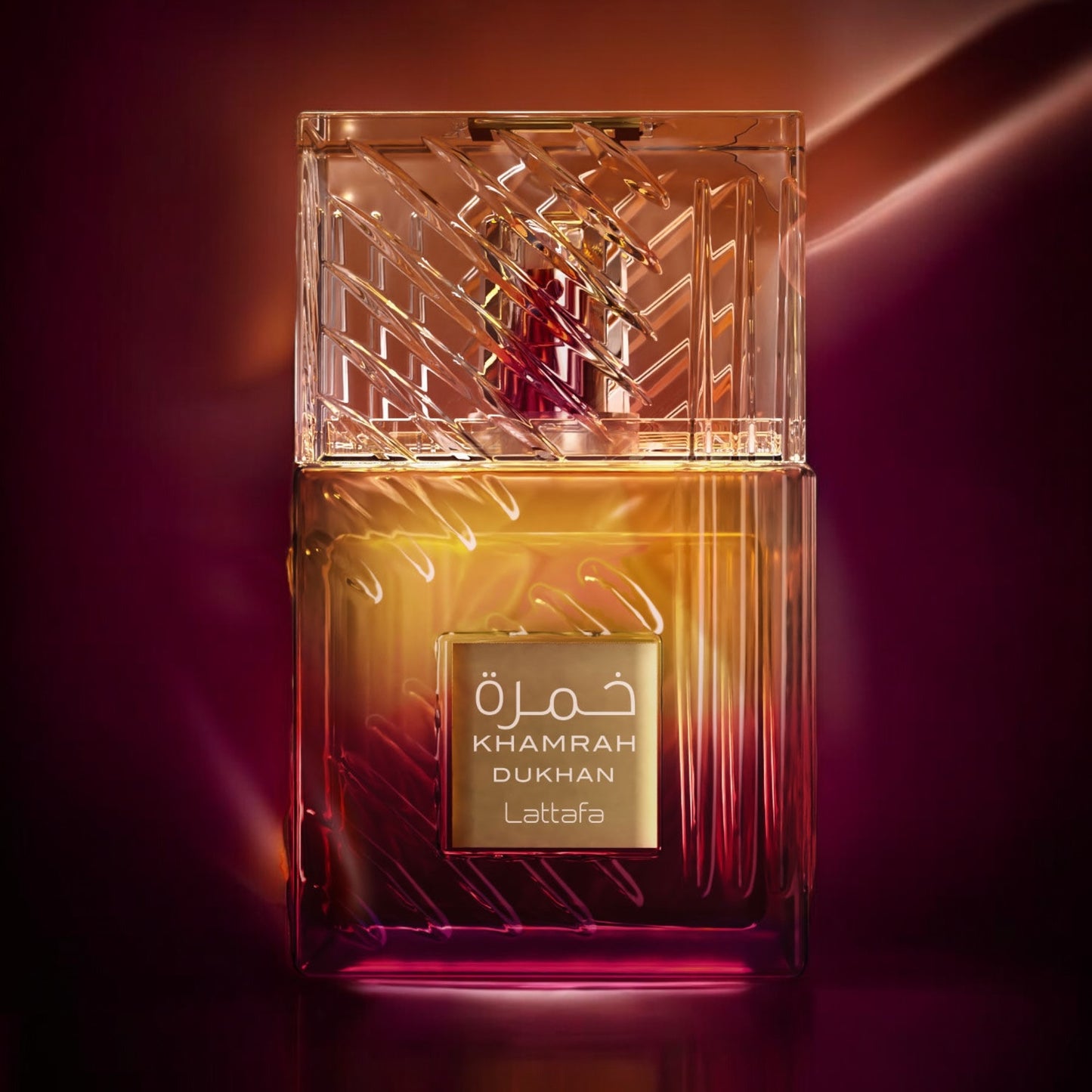 Close-up of a fragrance sample of Khamrah Dukhan, highlighting its smoky spice top, incense heart, and warm gourmand base.