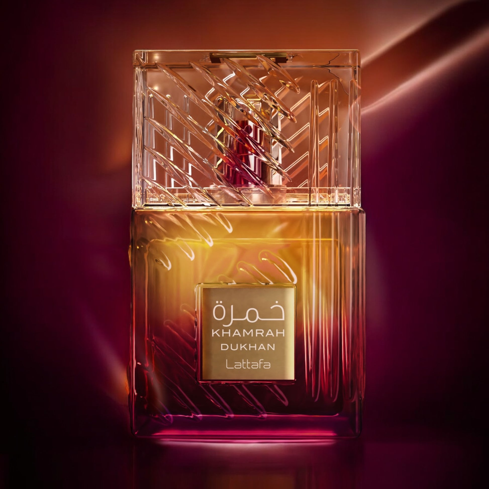 Close-up of a fragrance sample of Khamrah Dukhan, highlighting its smoky spice top, incense heart, and warm gourmand base.