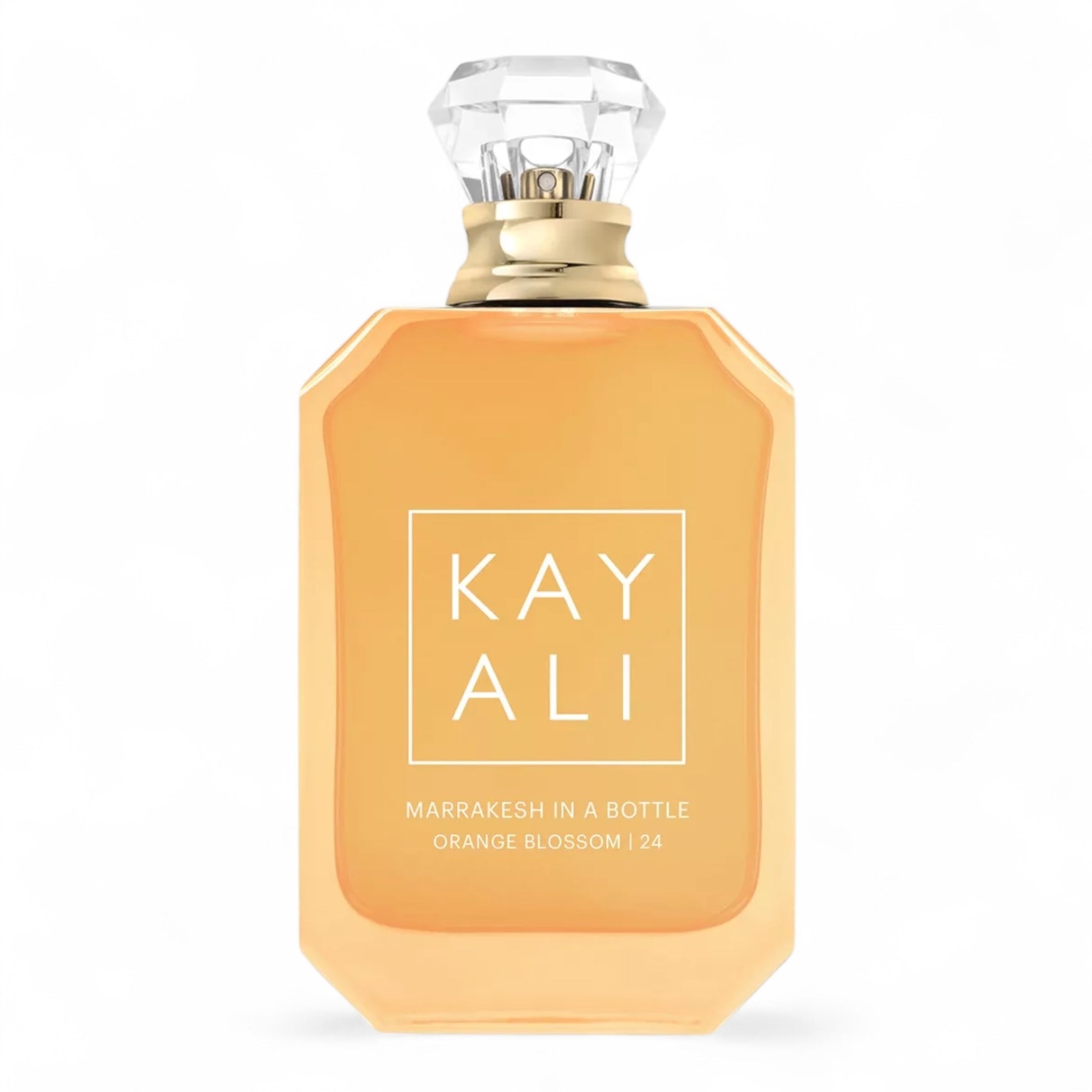 Kayali Marrakesh in a Bottle Orange Blossom | 24 sample surrounded by orange blossoms, rose petals, and Moroccan lanterns.