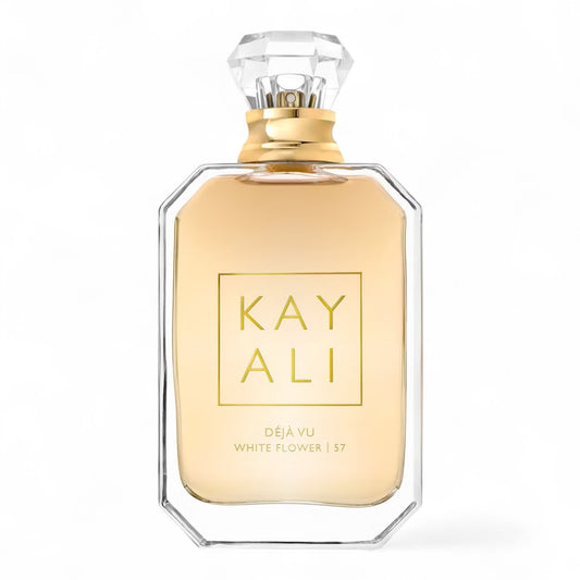 Kayali Déjà Vu White Flower | 57 sample bottle surrounded by gardenia, jasmine, and warm woods.