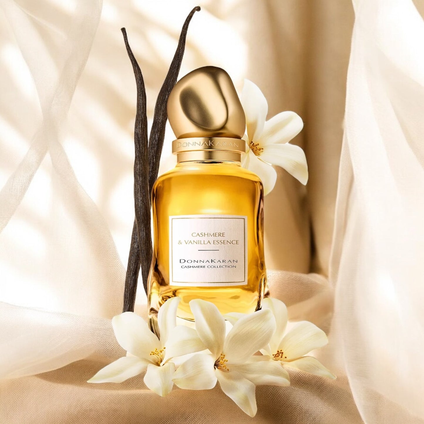 Close-up of a perfume sample of Cashmere & Vanilla Essence, showcasing its soft blend of floral heart and warm vanilla base.