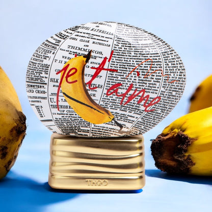Close-up of a L’Explicite fragrance sample, showcasing its blend of sweet banana bread, warm spices, and creamy musks for a bold and indulgent scent experience.