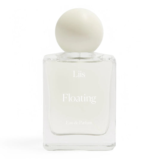 A decant of Liis Floating, a fresh and airy fragrance with peach, wild orchid, and sequoia wood, available in perfume samples and decants.