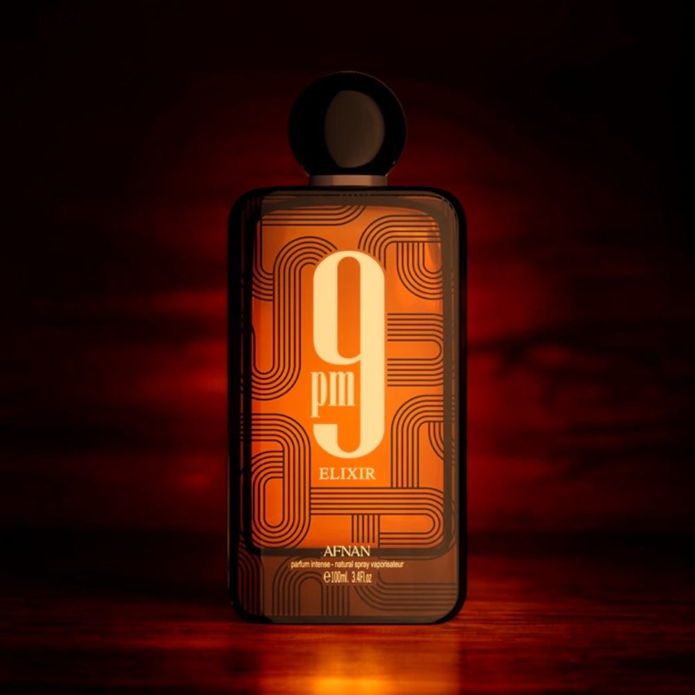 Afnan 9PM Elixir perfume sample - spiced leather and warm vanilla fragrance styled in an elegant evening setting.