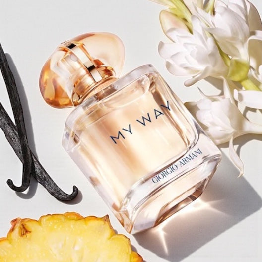 Armani My Way Sunny Vanilla perfume styled in a bright, sunlit tropical setting