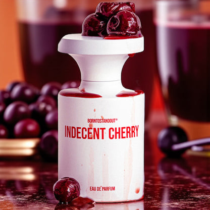 BORNTOSTANDOUT Indecent Cherry perfume sample – cherry, almond and amber notes styled in a dark red, seductive setting.