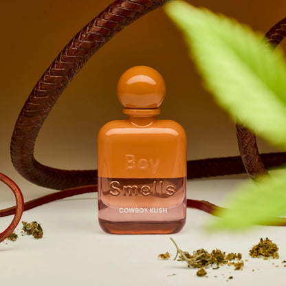 Boy Smells Cowboy Kush perfume styled in a rugged, smoky setting