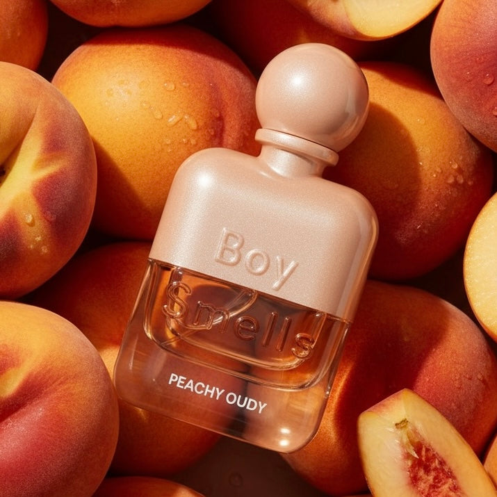 Boy Smells Peachy Oudy styled with ripe peaches