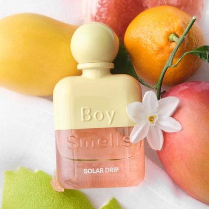 Boy Smells Solar Drip perfume styled in a sunlit, modern setting