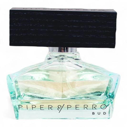 A decant of Piper & Perro Bud, a floral-woody perfume with Bulgarian rose, pineapple leaves, and bourbon, available in fragrance samples.