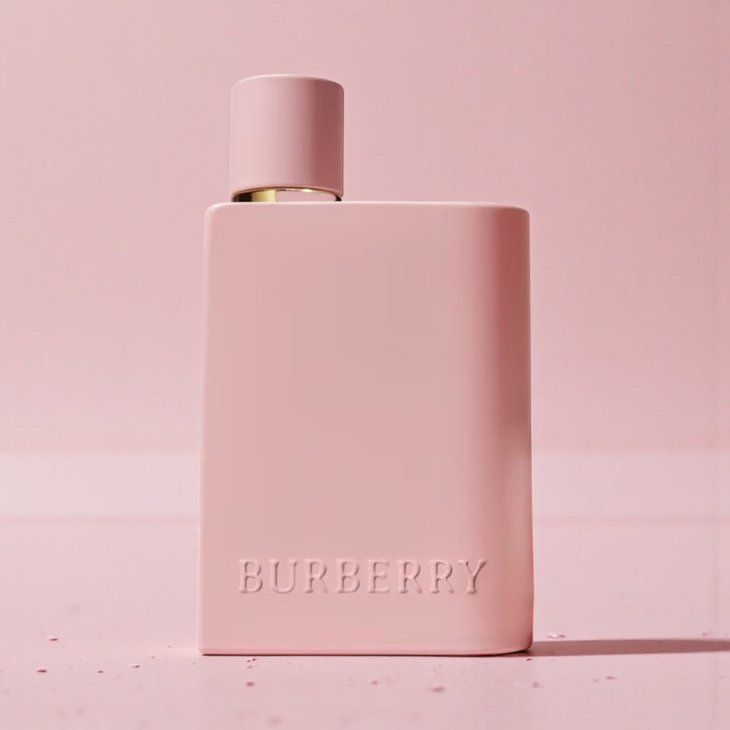 Burberry Her Parfum perfume sample styled in a warm pink urban setting to reflect its cherry sweetness and amber gourmand character.