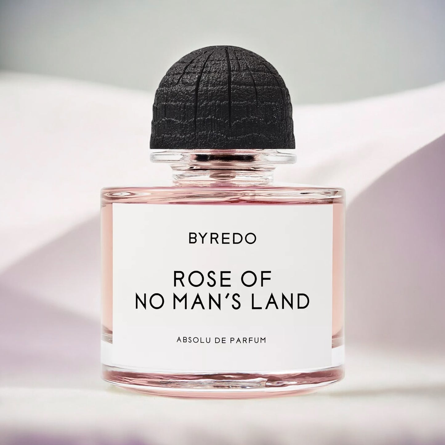 Byredo Rose of No Man’s Land Absolu perfume sample – smoky rose and black amber fragrance, styled in an elegant setting.