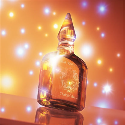 Charlotte Tilbury Star Confidence bottle styled on a vanity with soft golden light.