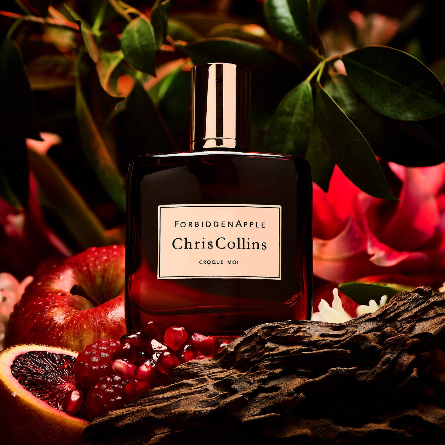 Chris Collins Forbidden Apple Croque Moi perfume styled in a rich, decadent setting