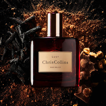 Chris Collins Lust Oud Délice perfume styled in a warm, gourmand setting