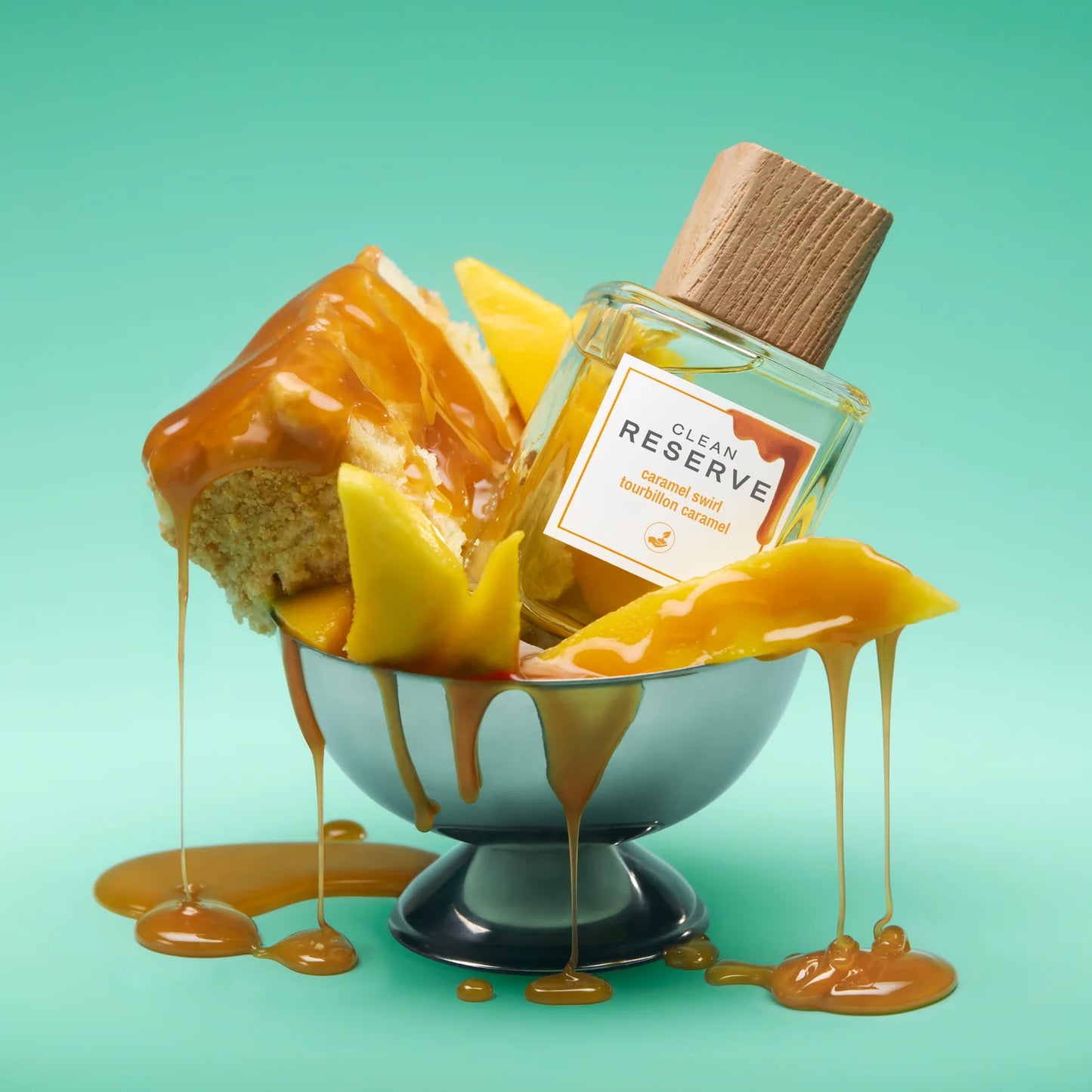 Clean Reserve Caramel Swirl perfume styled in a playful, dessert-inspired setting