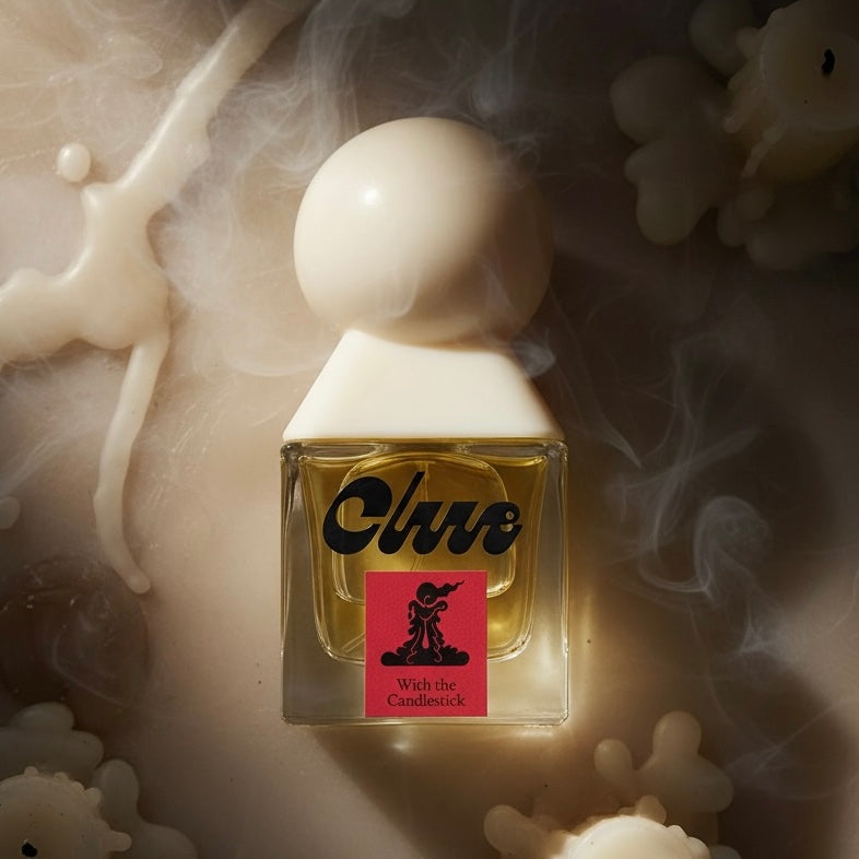 Clue Perfumery With the Candlestick styled with burning candles, incense smoke and warm resinous woods