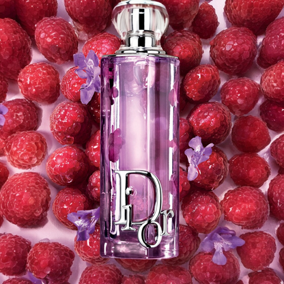 Dior Addict Purple Glow perfume styled in a vibrant raspberry and iris setting