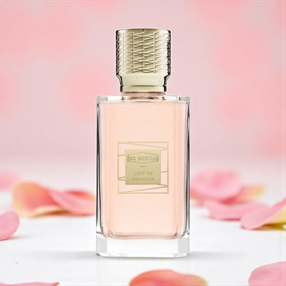 Ex Nihilo Lust in Paradise perfume sample – radiant peony, lychee, and musk notes styled in a sunlit floral setting.
